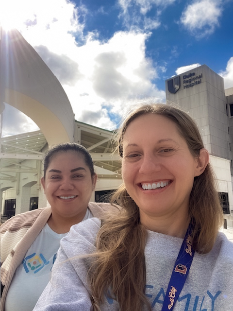 Two Family Connects Durham staff standing in front of a hospital building.